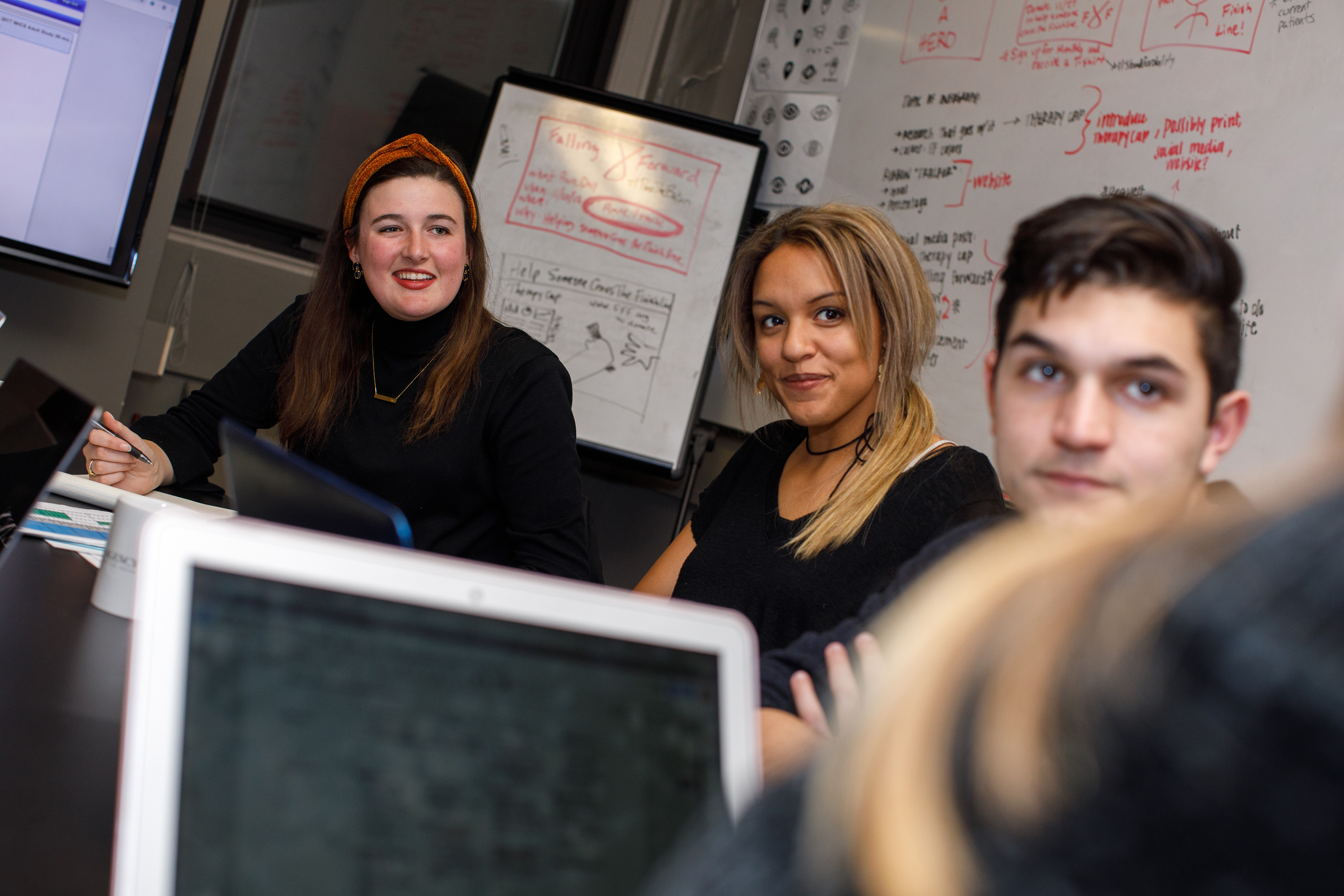 Students at KU's School of Journalism and Mass Communications marketing agency collaborate on a creative project